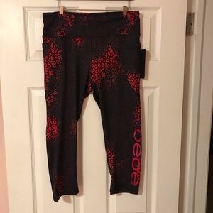 Bebe women’s leggings pink purple spots NWT L